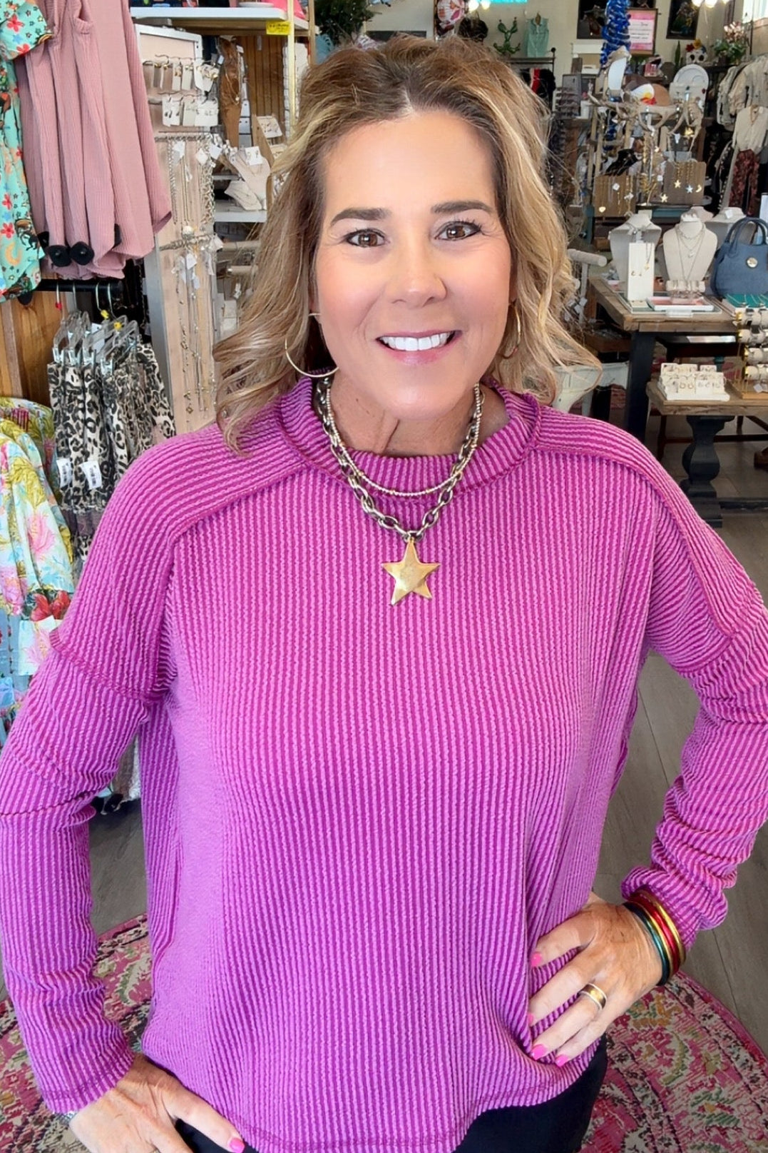 MODEL IN PINK LONG SLEEVE TOP

