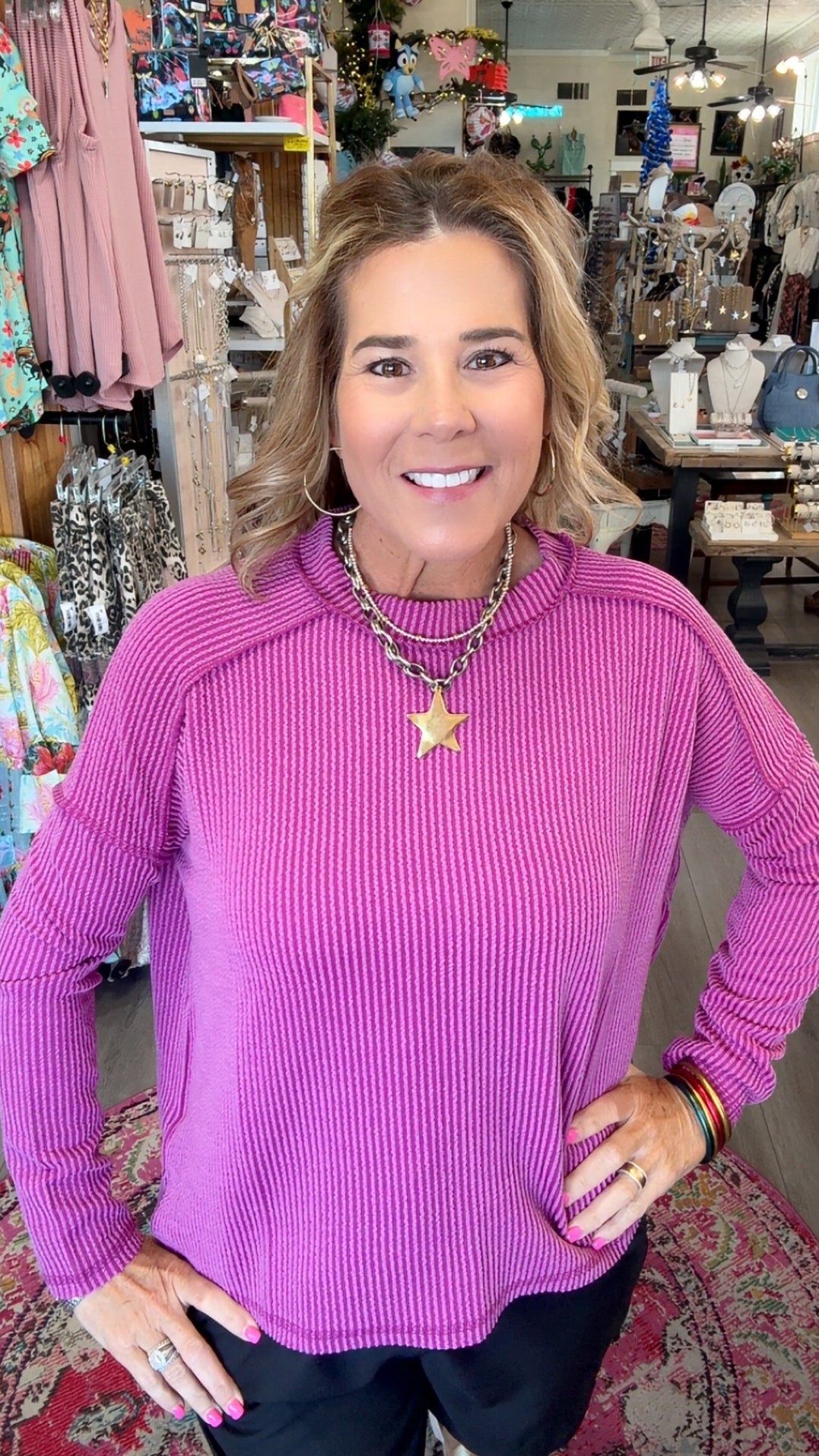 MODEL IN PINK LONG SLEEVE TOP
