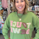 MODEL IN GREEN SWEATSHIRT SAYING TOUCH DOWN
