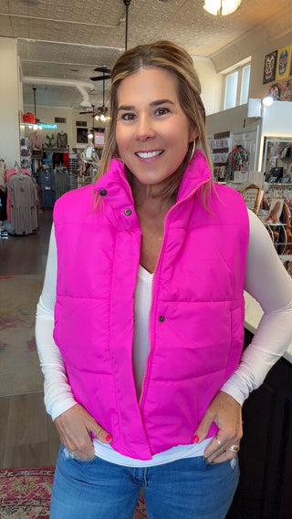 lady in pink vest in a boutique
