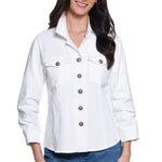 Woman wearing a white denim jacket with button details on a white background