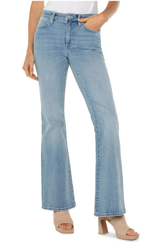 Light blue jeans worn by a person on a white background