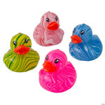 Four rubber duck toys with marbled swirl patterns in green and yellow, pink and white, blue and white, and red-orange beaks, arranged on a plain white background.