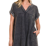 Woman wearing a black and white checkered dress on a white background