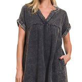 Woman wearing a black and white checkered dress on a white background