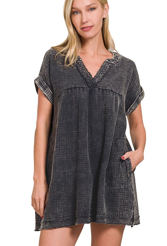 Woman wearing a black and white checkered dress on a white background