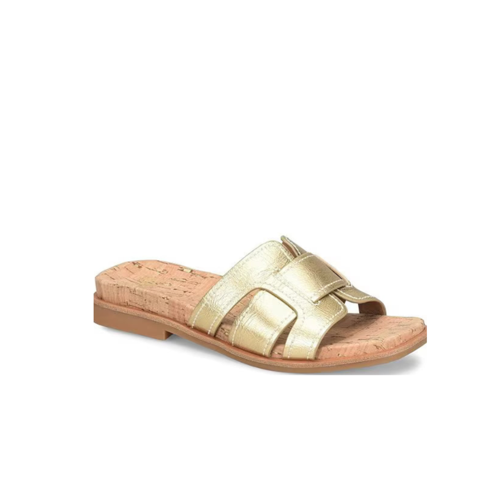 Gold sandal with cork sole on a white background