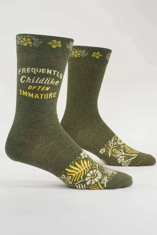 A pair of green socks with text and floral patterns on the ankle area, displayed in a standing position.