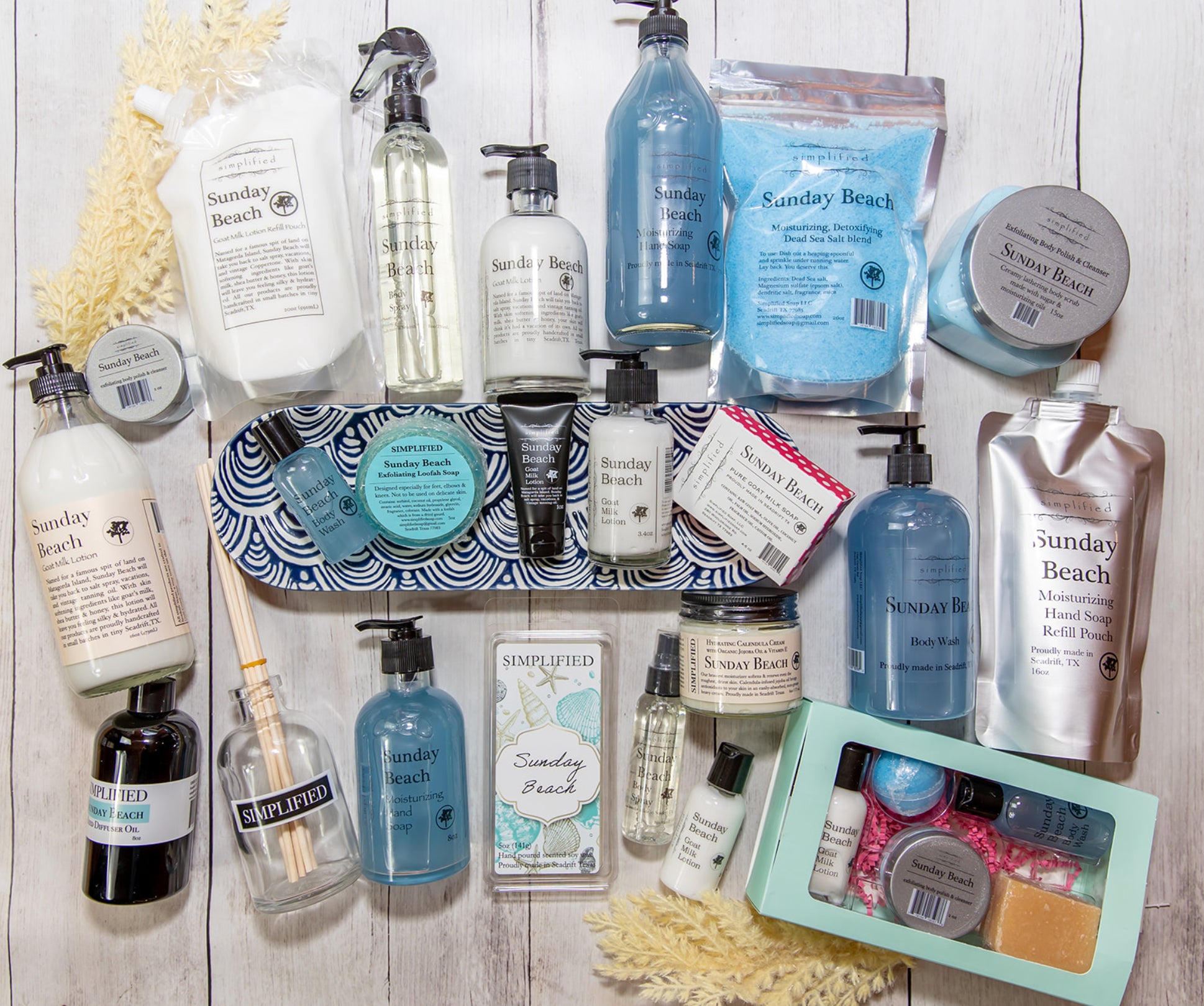 Collection of Sunday Beach products on a wooden surface