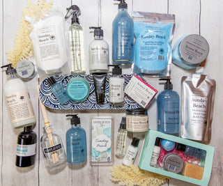 Collection of Sunday Beach products on a wooden surface