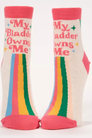Pair of socks with colorful rainbow design and text on a white background