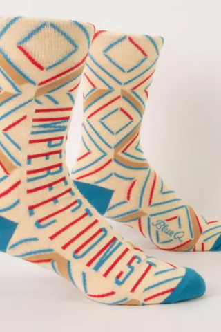 Colorful patterned socks with geometric design on a white background