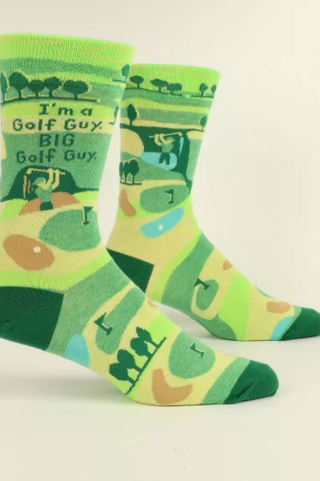 Golf-themed socks with green and yellow design on a white background