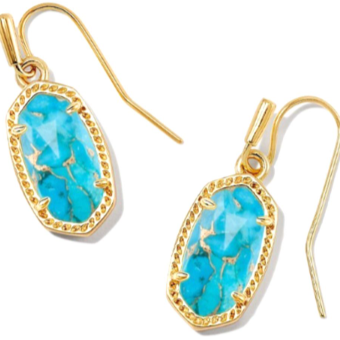 Gold earrings with turquoise stones on a white background