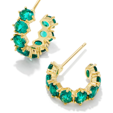 Gold hoop earrings with green gemstones on a white background