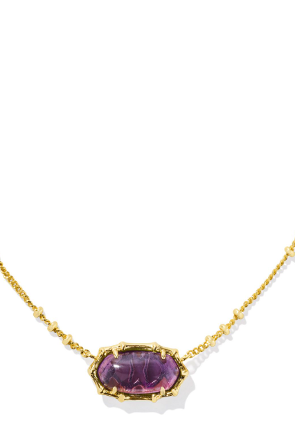 A gold-colored bamboo-textured necklace with a sage green serpentine pendant on a white background.