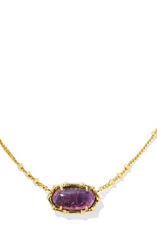 A gold-colored bamboo-textured necklace with a sage green serpentine pendant on a white background.