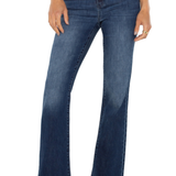 Blue jeans worn by a person on a white background