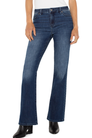 Blue jeans worn by a person on a white background