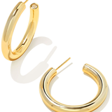 Gold hoop earrings on a white background