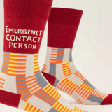 Colorful socks with 'Emergency Contact Person' text on a white background