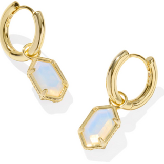 Gold hoop earrings with hexagonal gemstones on a white background