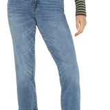 Blue jeans worn by a person on a white background