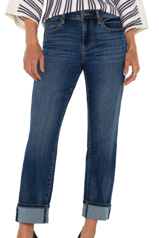 Blue jeans worn by a person on a white background