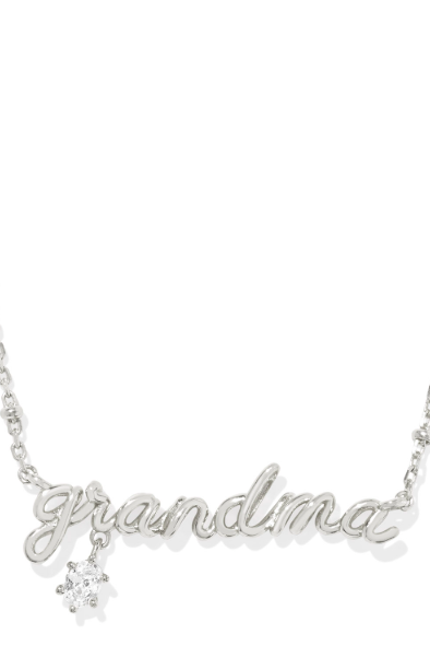 A silver-colored Grandma necklace with a crystal embellishment on the pendant, designed in a cursive script.