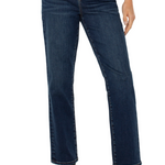Person wearing dark blue jeans on a white background