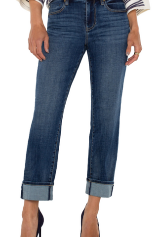 Blue jeans worn by a person on a white background