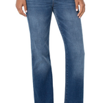 Blue jeans worn by a person on a white background