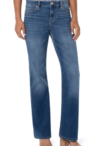 Blue jeans worn by a person on a white background