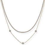 Two layered necklaces with small round stones on a white background