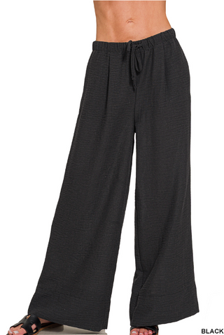 Black wide-leg pants with a drawstring waist on a white background