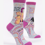 Pair of socks with dog-themed illustrations and text on a white background