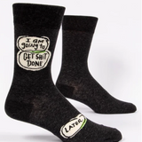 Black socks with humorous text design on a white background