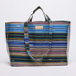 Multicolored striped tote bag on a white background