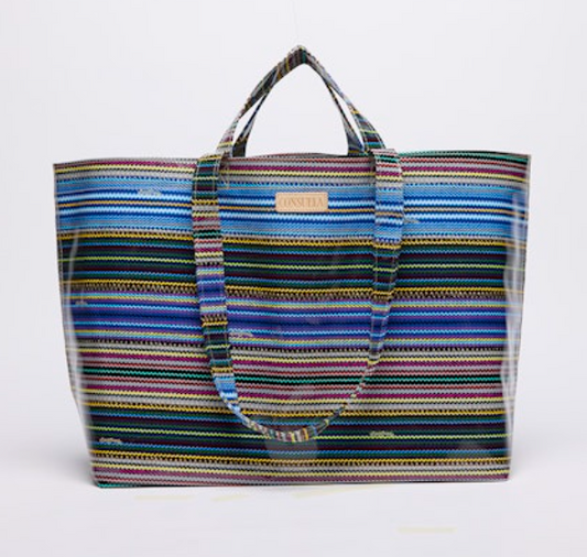 Multicolored striped tote bag on a white background