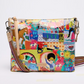 Colorful patterned handbag with a strap on a white background