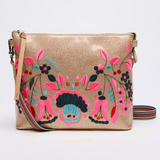 Beige handbag with colorful floral embroidery on a white background