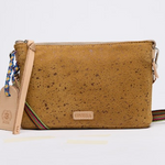 Brown cork handbag with a strap on a light gray background