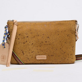 Brown cork handbag with a strap on a light gray background