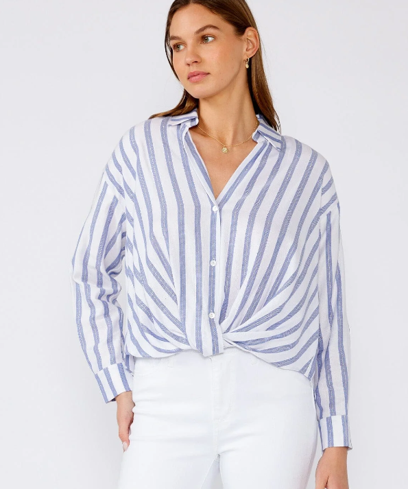 Woman wearing a blue and white striped shirt against a white background
