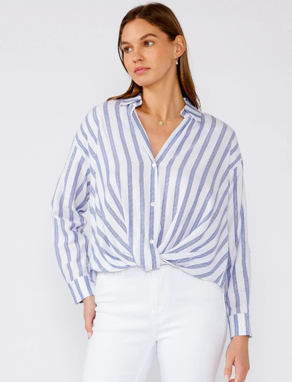 Woman wearing a blue and white striped shirt against a white background