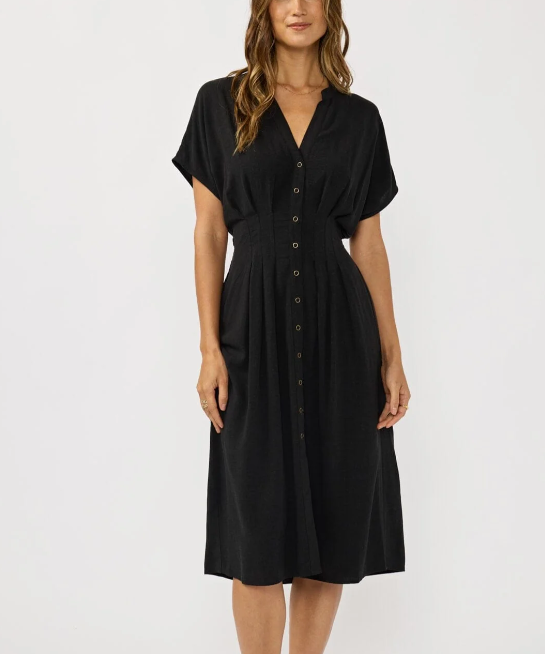 Woman wearing a black dress against a white background