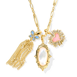 Gold necklace with various pendants on a white background