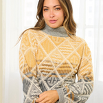 Woman wearing a patterned sweater with a neutral background