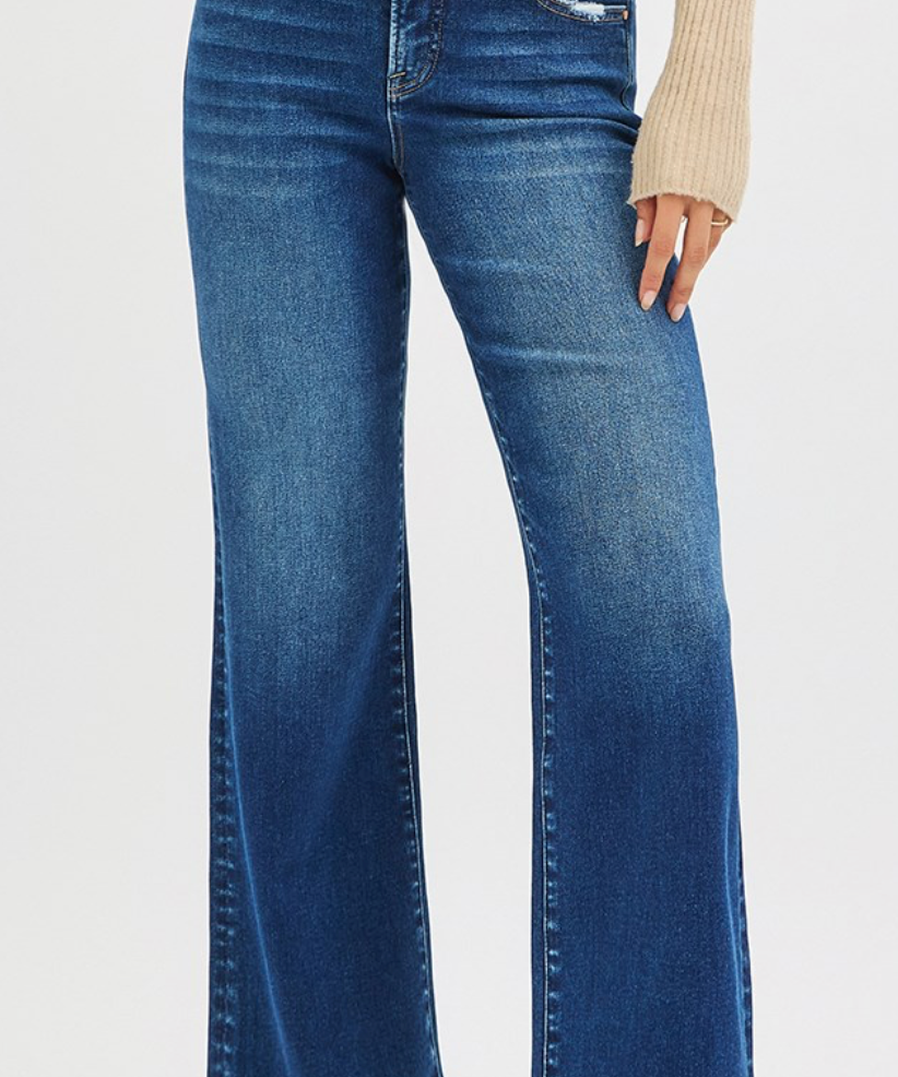 Blue jeans worn by a person on a white background