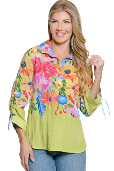 Woman wearing a colorful floral blouse with a white background